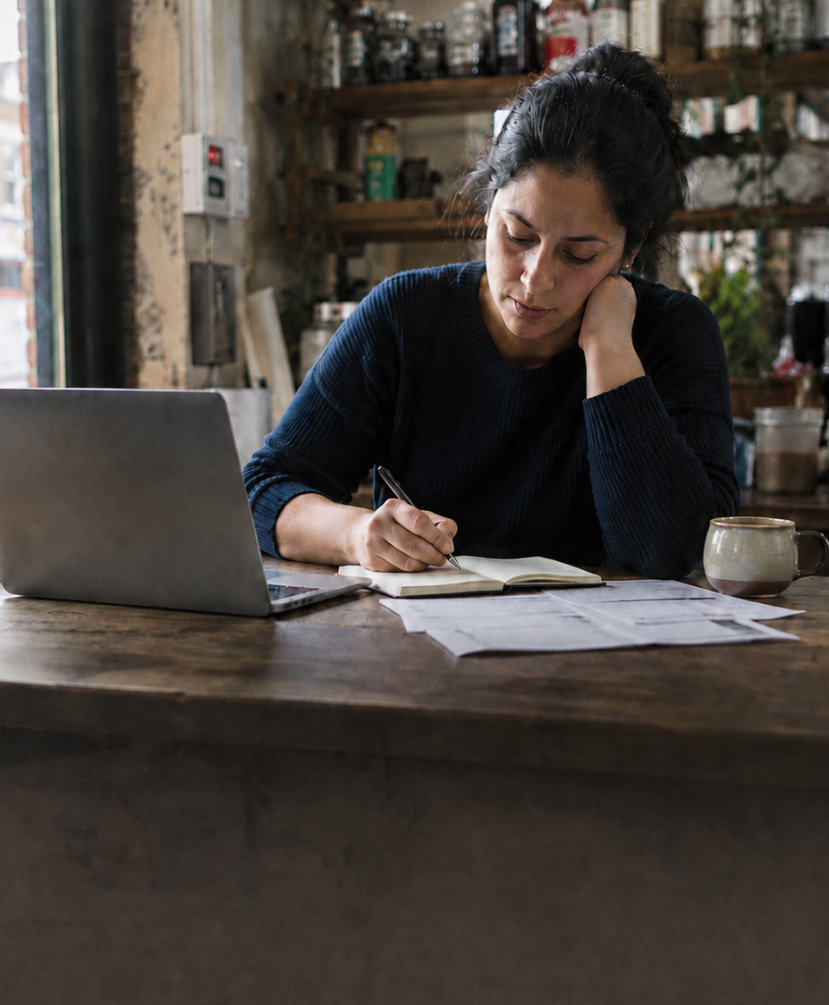 London small business owner reviewing business tasks